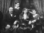 Studio portrait of a Hungarian-Jewish family.

Pictured from left to right are Zoltan, Paul, Iren and Robert Fisch.
