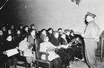 American Army chaplain Klein provides religious instruction to French Jewish children after liberation.