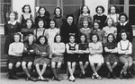 Class portrait of girls in a French elementary school.