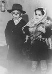 Close up portrait of a boy and girl in dress-up winter clothes in the Jewish kindergarten in Lodz.