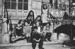 A group of children poses outside on the steps of Pringy, a children's home sponsored by the Swiss Red Cross.