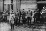 Group portrait of Nazi officers standing in front of a building in Solahutte, the SS retreat outside of Auschwitz.