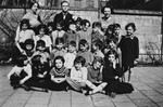 Group portrait of young children and teachers in a class of a Talmud Torah in Amsterdam.