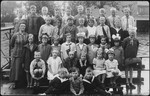 Class portrait of a Dutch elementary school.

Among those pictured is David Van Gelder (second row from the top, second from the left).