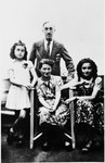 Portrait of a French-Jewish family wearing Jewish stars.