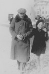 Jewish refugees on a street in Vilna.

Pictured are Tamara Dynenson and her uncle Aron Wecksler.