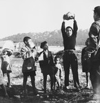 A group of Morrocan-Jewish boys gathers together in the Los Arenas camp while waiting to immigrate to Palestine.