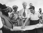 Ambassador James Grover McDonald and his daughter Barbara examine a building plan in a religious settlement in Israel.