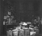 Close-up of a shop window in the Warsaw ghetto.

Joest's original caption reads: "In the window there were beans, grits, legumes, salt.