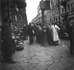 Vendors selling bread on the street in the Warsaw ghetto.