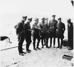 SS Obergruppenführer Ernst Schmauser inspects the Gross-Rosen concentration camp in the company of other SS officers.