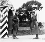 Guards stand at attention at a checkpoint at the Gross-Rosen concentration camp.