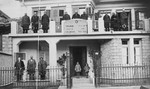 A group of Greek-Jews poses on the balcony and in front of the main entrance to the Beit Yeshua veRahel Hebrew Home for the Aged in Ioannina.