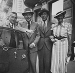 Four friends pose next to an automobile.  

Among those pictured are Alfred and Lill Rahn (third and fourth from the left).