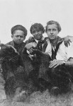 Jan Yoors (right) sits with two Romani friends.