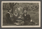The Szwarcman family poses outside in prewar Aleksandria.