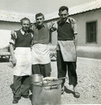 Three men pose behind a soup pot at Ferramonti.

Ernest Hellinger is probably the man in the middle.