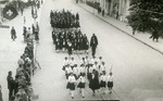 Members of the Fascist Youth movement Picolo Italiana march down a street in Merano in honor of Mussolini.