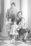 Studio portrait of Perla and Felix Nahmani with their three oldest daughters Diamante, Aimee and Reine.