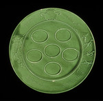 Green glazed earthenware Passover seder plate made by Jewish DPs in the Föhrenwald displaced persons camp.