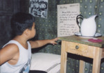 A young visitor reads one of Daniel's diary entries while touring the "Remember the Children" exhibition at the U.S.