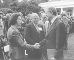President Jimmy Carter shakes the hand of Vladka Meed during a ceremony in the White House rose garden occasioned by the formal presentation to the president of the report of the U.S.