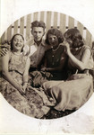 Riva and Dimo Szrajer (far left) sit outside with friends.