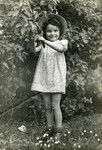 Basia Szrajer stands in a garden in the Neu Freimann displaced persons camp.