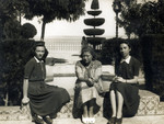 Young women rest in a park en route to Palestine.