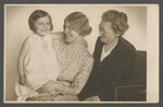 Three generation photograph of a grandmother, mother, and daughter.