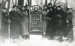 The Rybak family gathers around the tombstone of Yitzhak Meir Rybak, the father of Rivka Miedzyrzecki (nee Rybak).