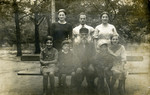 The Rybak family poses on a park bench in prewar Warsaw.