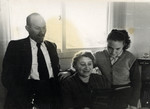 Genia Miedzyrzecki and her parents, Rivka and Israel Yizhak, looking at Vladka's (Benjamin's wife) memoir.